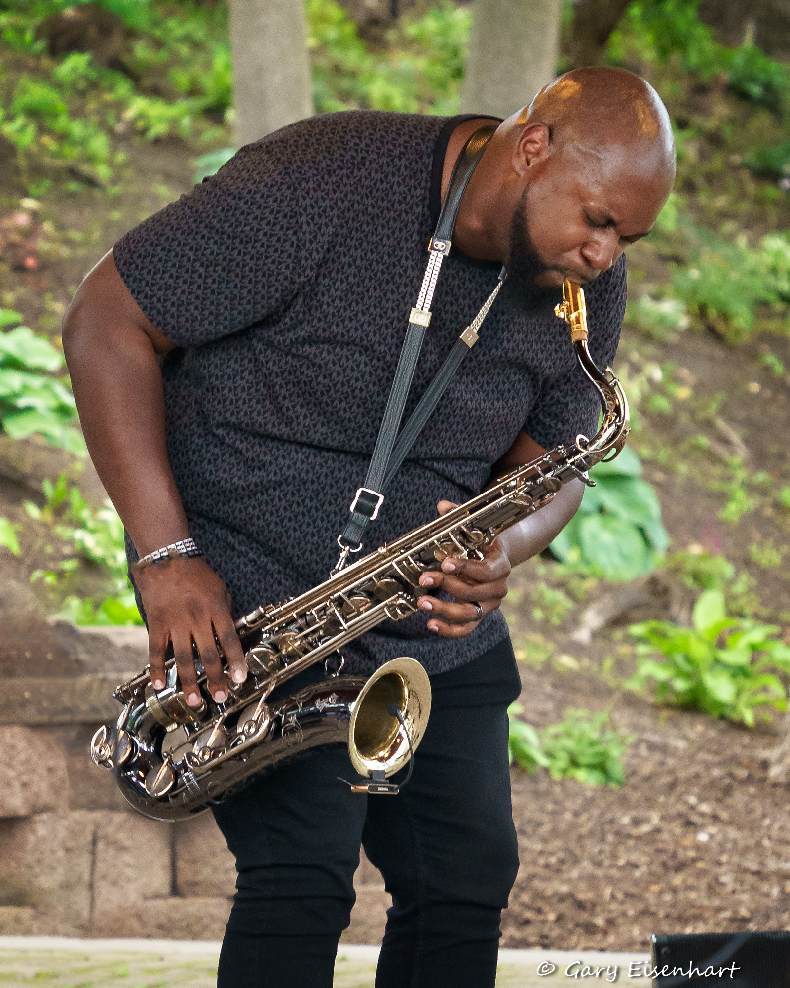 Photo jazz musician Judah Sealy playing sax at Carpenter Park Pittsford