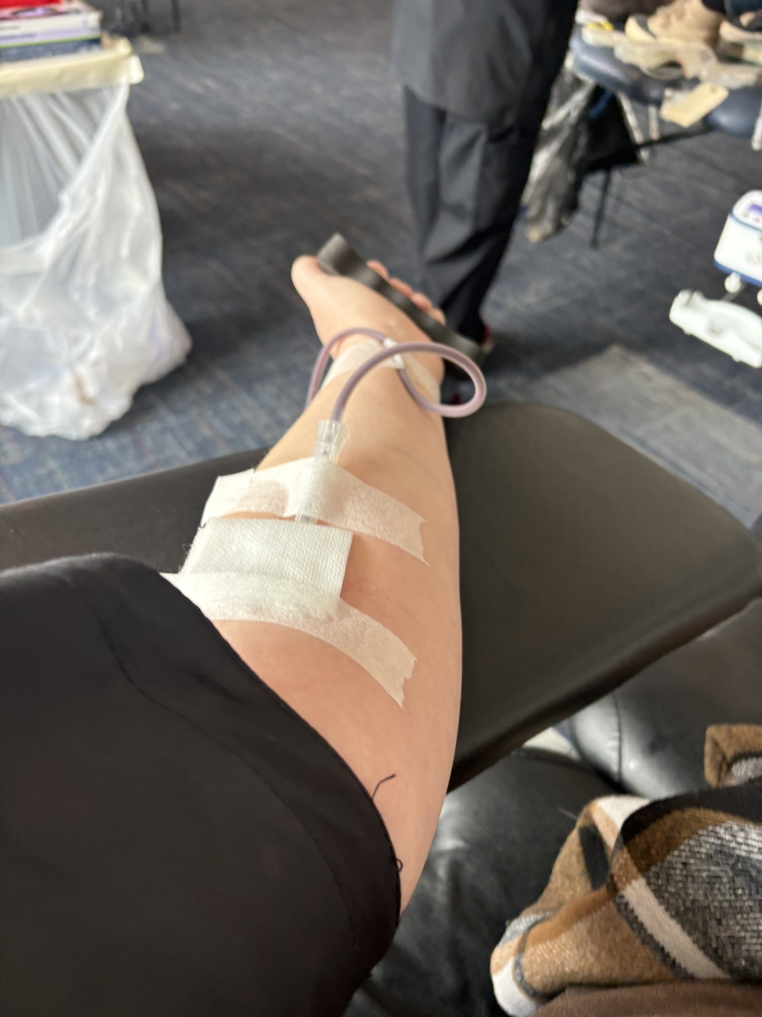 Needle inserted into arm to collect blood